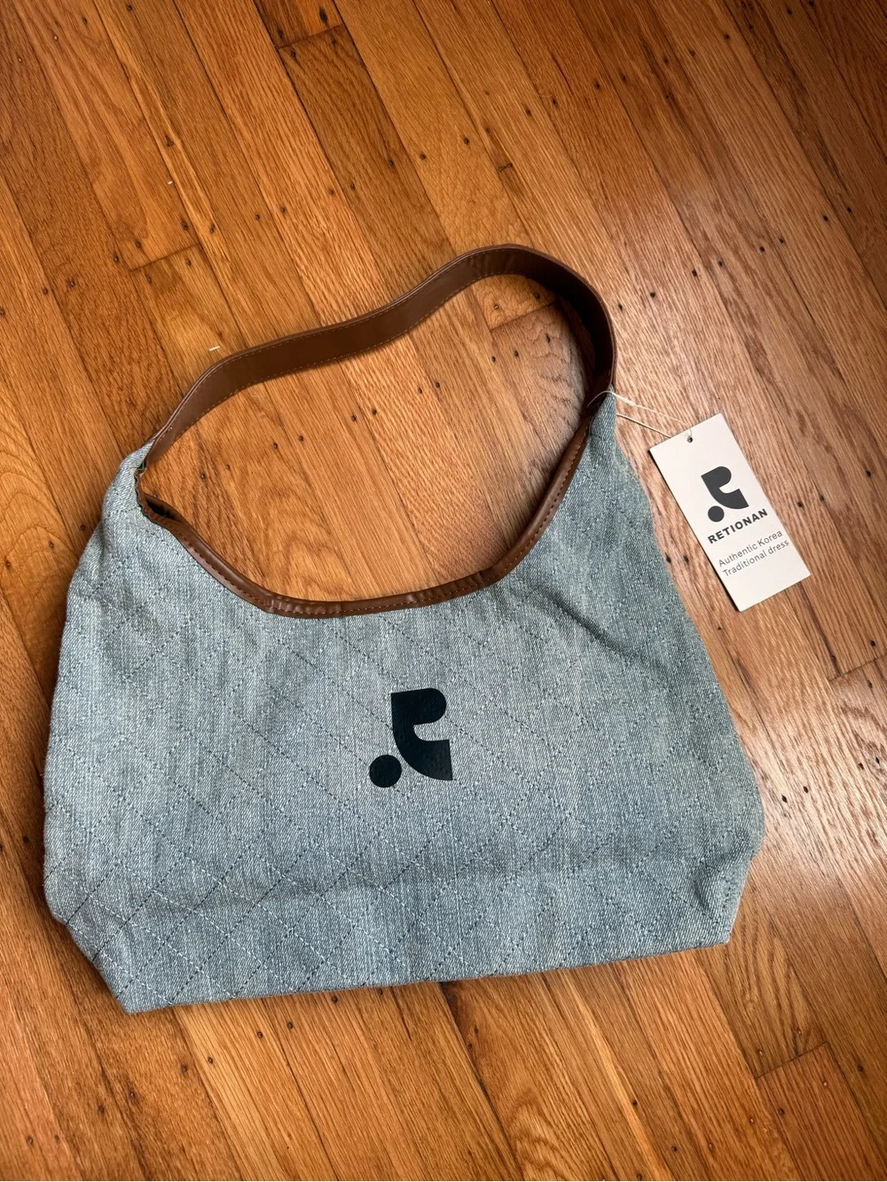 Quilted Light Blue Shoulder Bag with Brown Trim